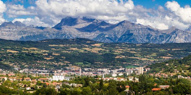 The city of Gap in the Hautes Alpes with surrounding mountains and peaks in Summer. Panoramic. Southern French Alps, France