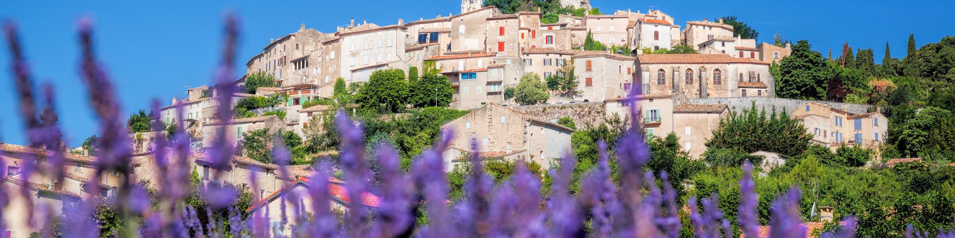 Simiane la Rotonde village with lavender field in Provence, France