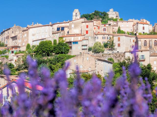 Simiane la Rotonde village with lavender field in Provence, France