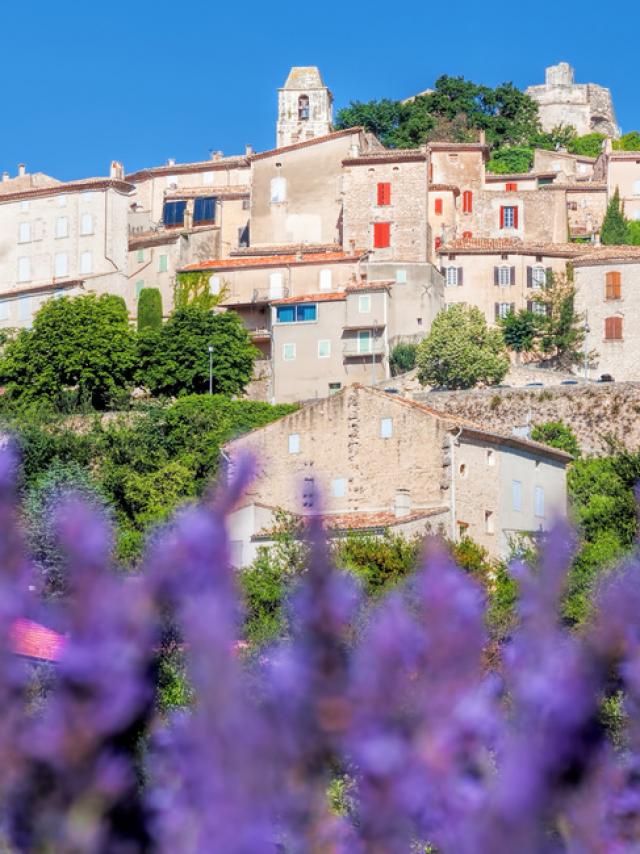 Simiane la Rotonde village with lavender field in Provence, France