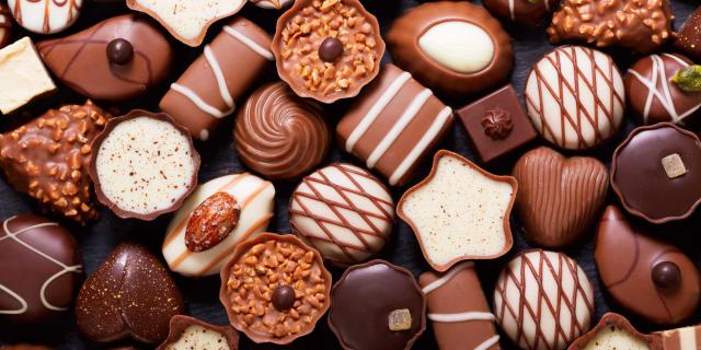 chocolate candies as background, top view