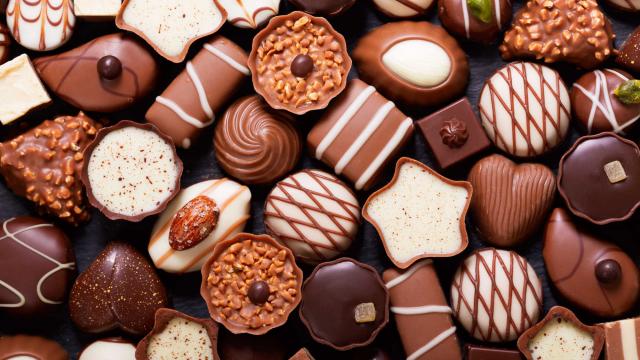 chocolate candies as background, top view