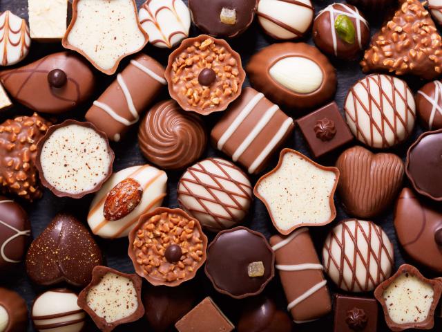 chocolate candies as background, top view