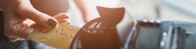 Customer pays by credit card at the cafe