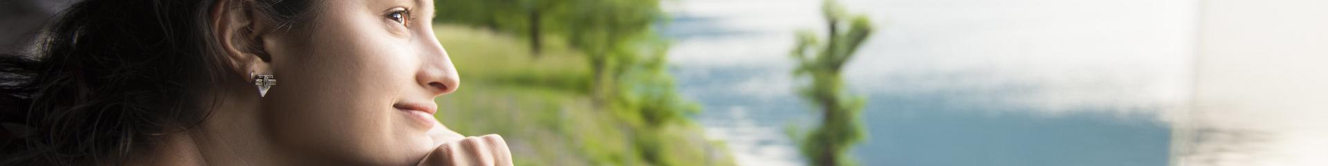 Smiling woman looking at the view from train