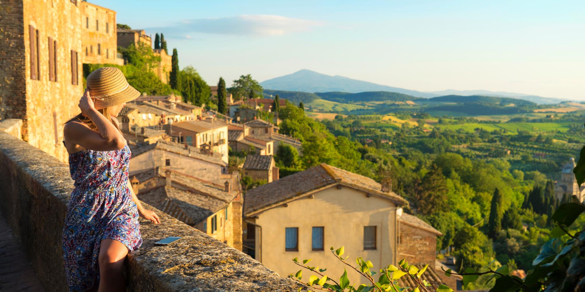 Montepulciano, Tuscany, Italy, Girl looks at the landscape of the city and countryside from the balcony