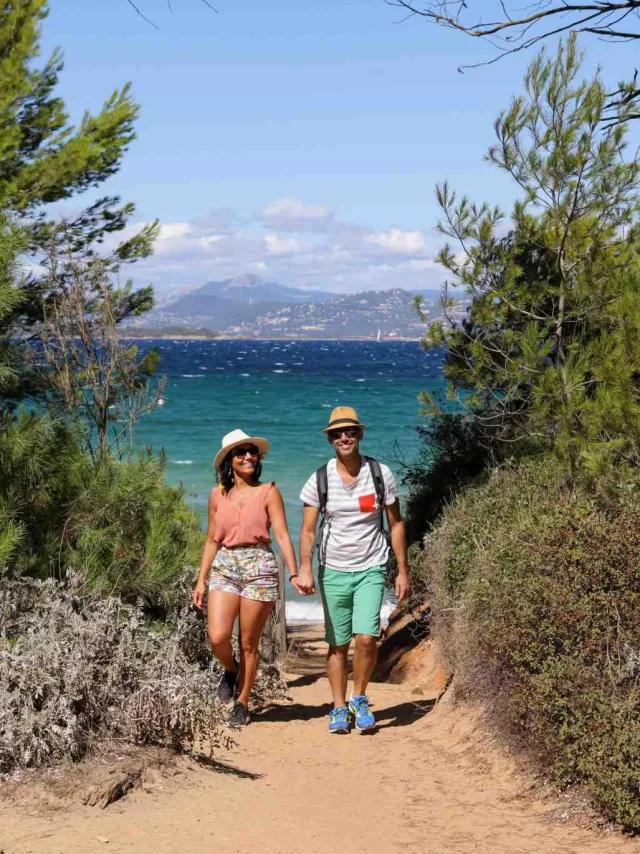 A couple strolling along a path in Porquerolles
