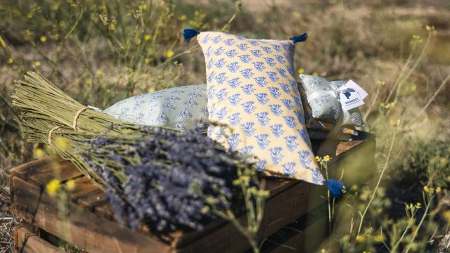 Close-up of the lavender cushions and sachets created by Elsa Lenthal in a field