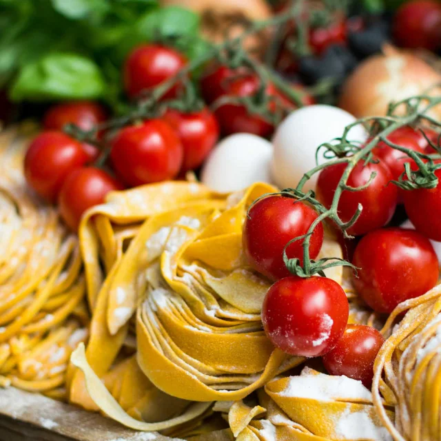 Close-up of fresh tagliatelle and cherry tomatoes