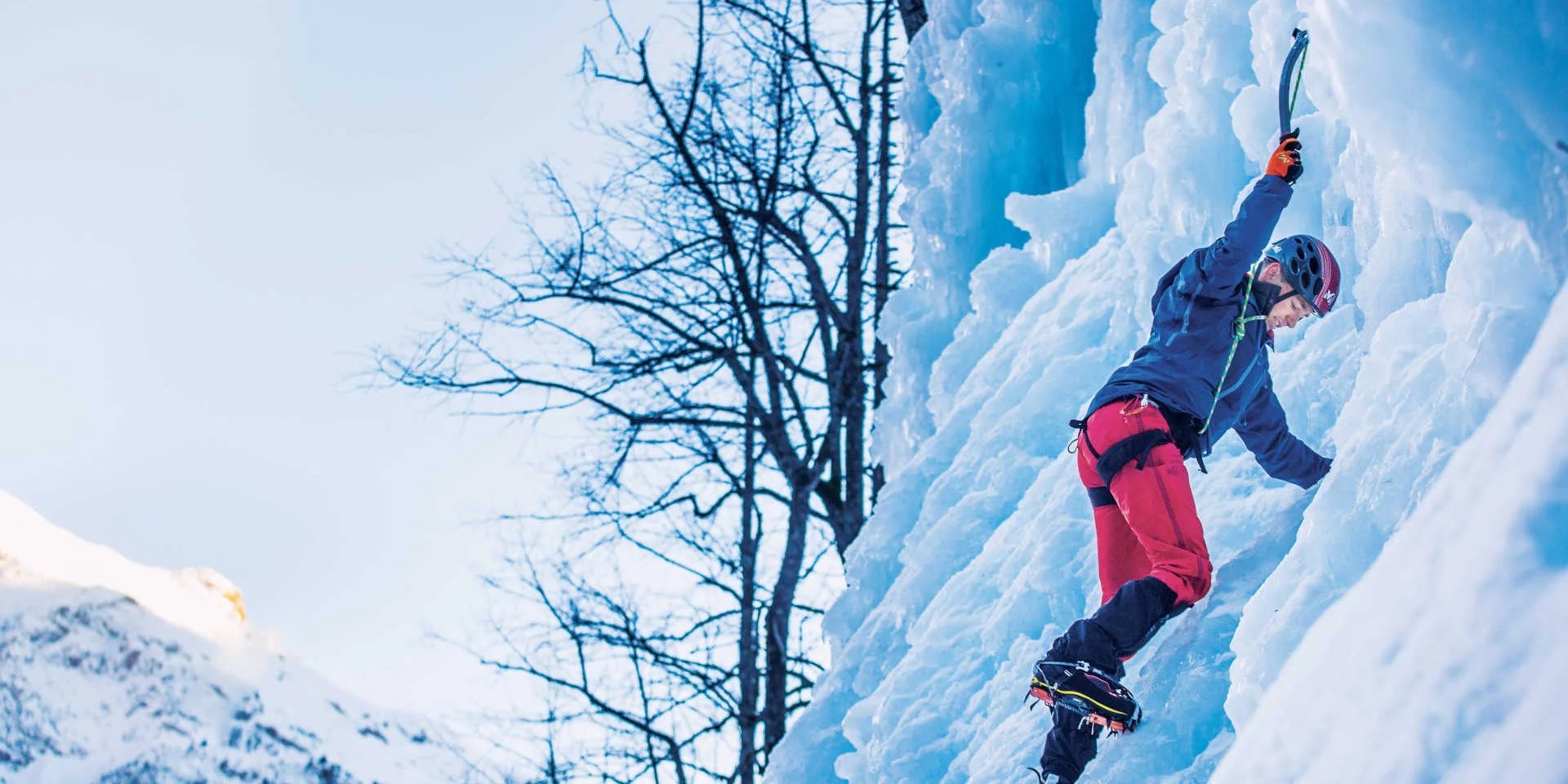 Man climbing an icefall in Pelvoux
