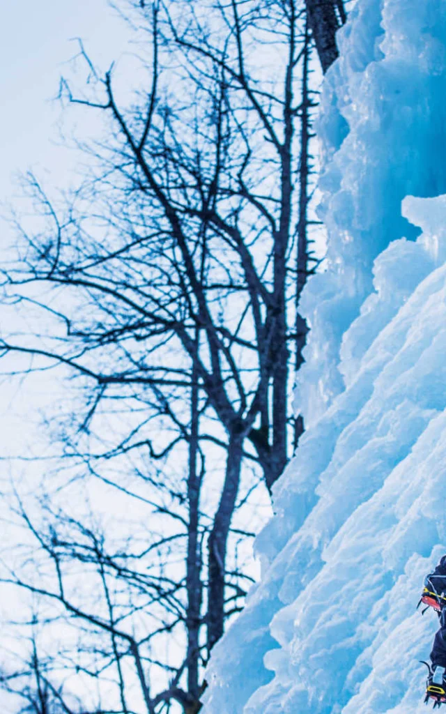 Man climbing an icefall in Pelvoux