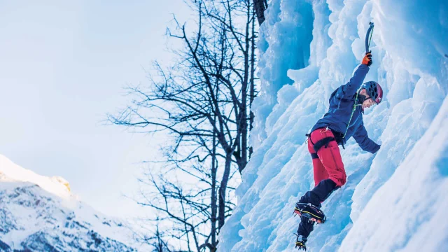 Man climbing an icefall in Pelvoux