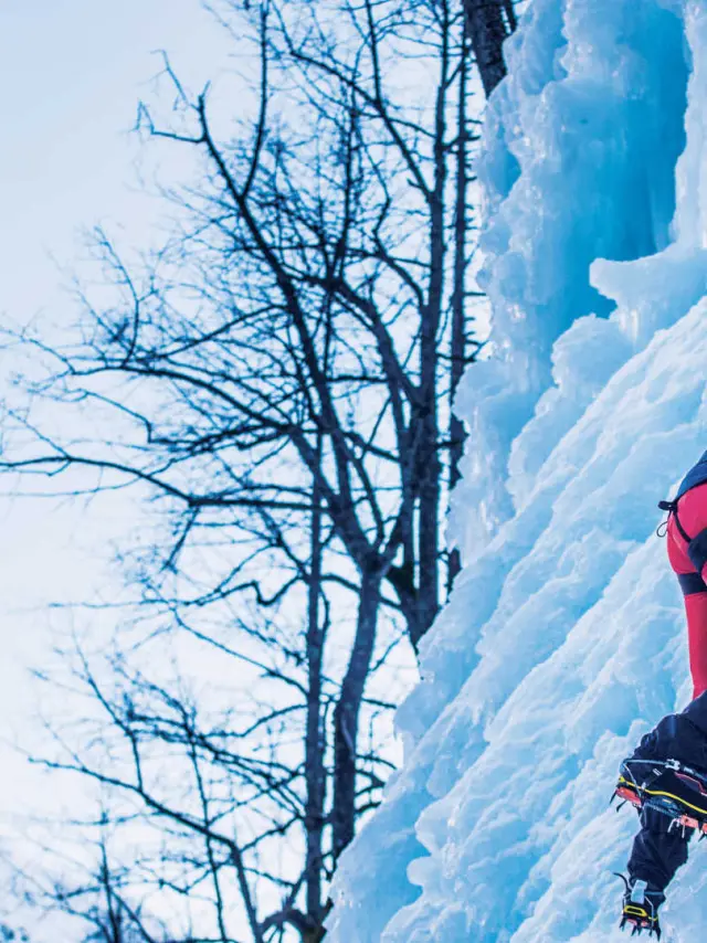 Man climbing an icefall in Pelvoux
