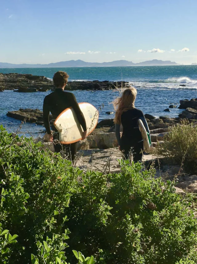 A couple surfing on the Côte Bleue