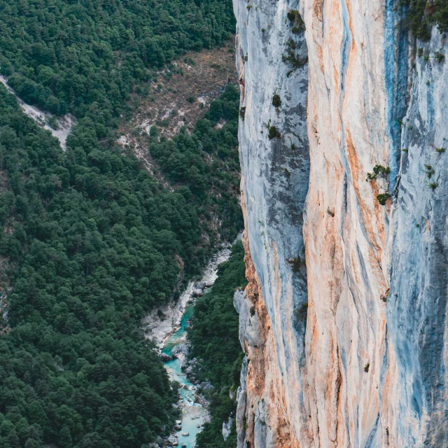 A climber hidden on a climbing wall in the Verdon