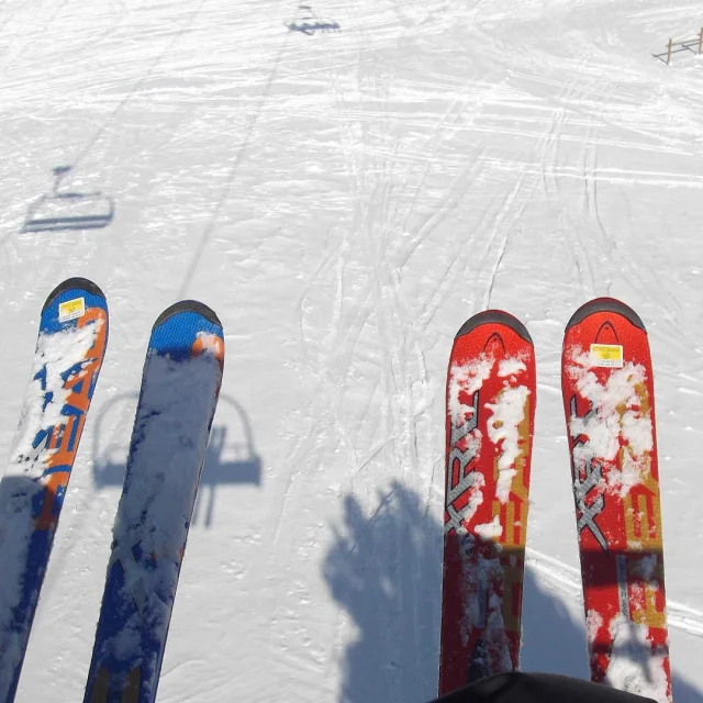 Two pairs of skis in the snow